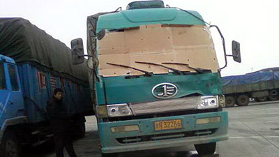 Chinese trucker drives with a cardboard windshield